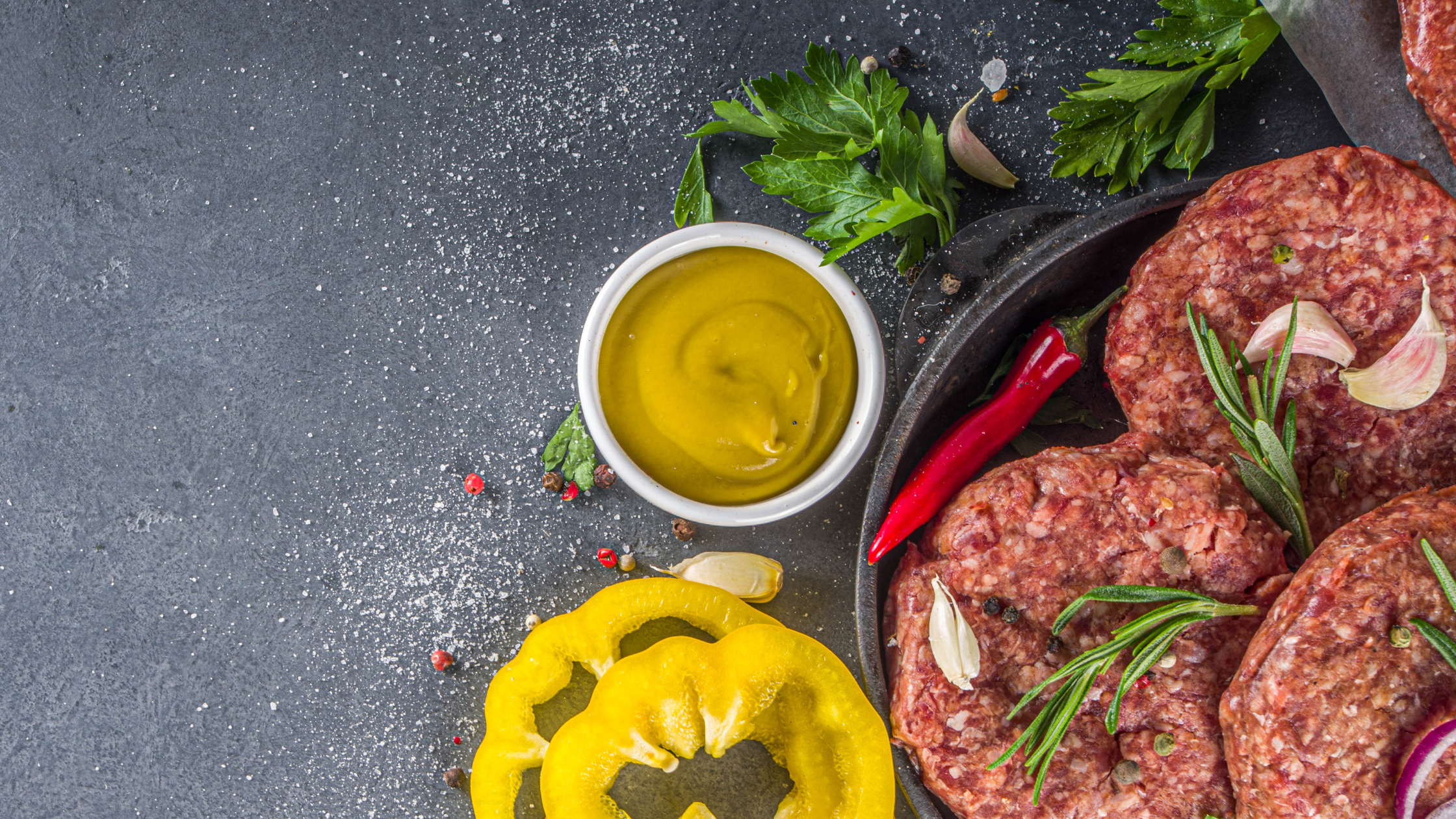 Lamb Burger patties with mustard on a plate